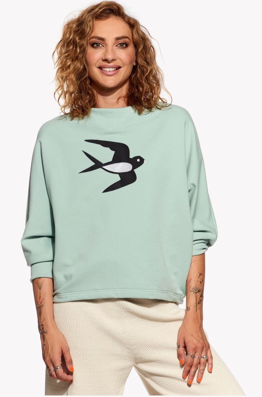 Kapucnis pulóver fecskével